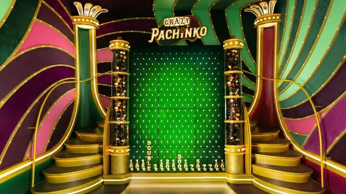 Crazy Time Pachinko puck drop screen with peg field and bottom slots